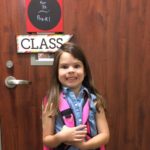young girl makes a funny face on her first day of Prek