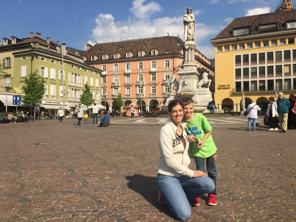 Mom and Son in Bolzano Plaza in the center of the city