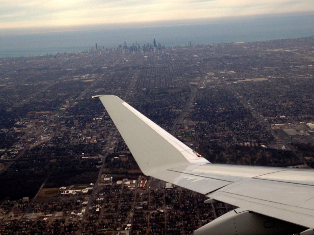 Airplane Wing as the plane turns near downtown Chicago