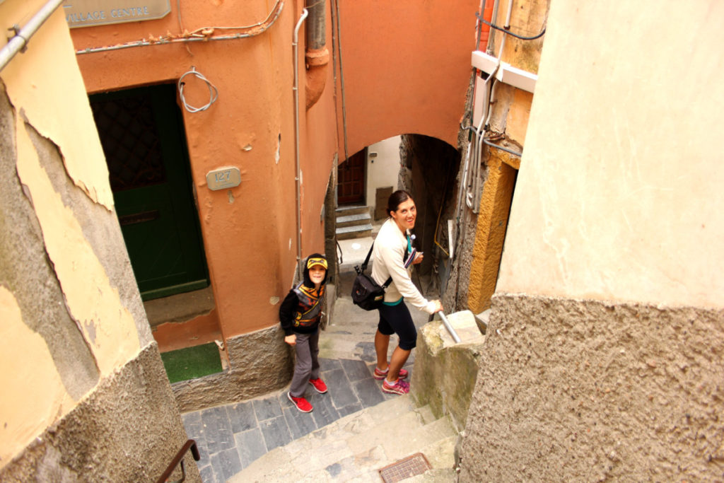 A woman and boy in Riomaggiore lost in the steps and streets