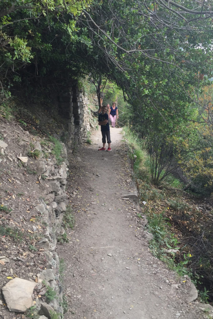  A young boy hikes on the blue trail in Cinque Terre, Italy