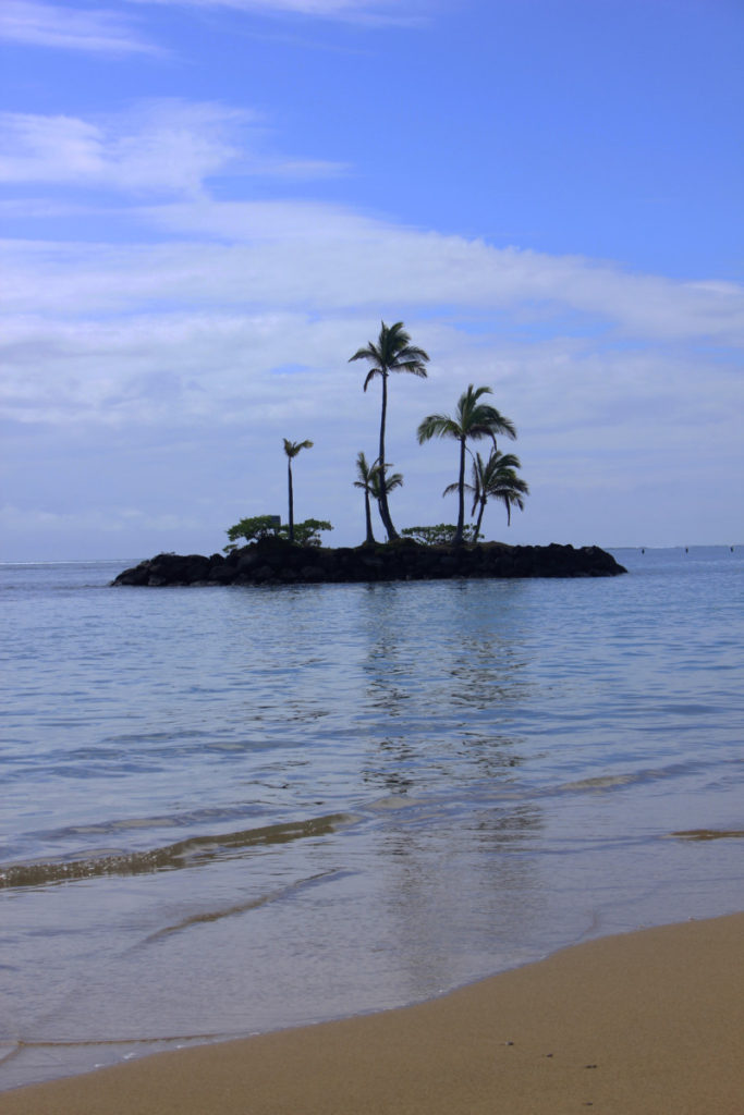 Tiny Tropical island off a beach on Oahu, Hawauu