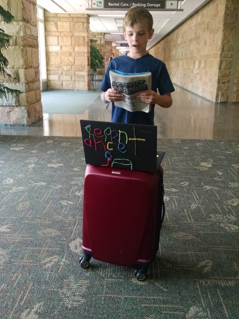 a Boy reading a talk prepared at the Knoxville Airport for Sunday Services