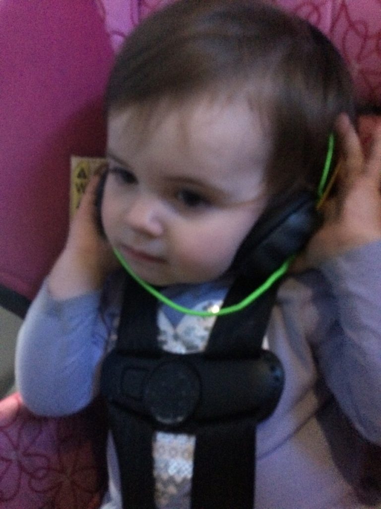 a Baby listens to music on headphones