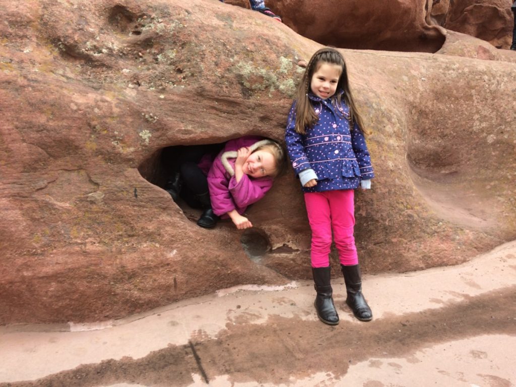 2 girls climb on Red Rocks in Denver, Colorado