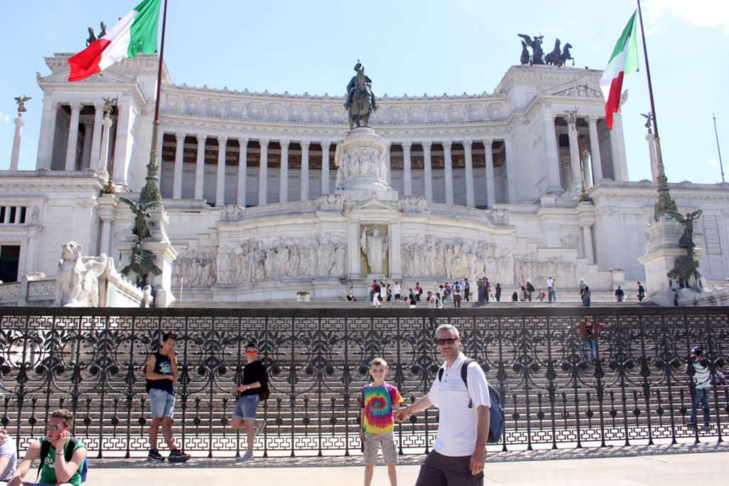 Father and Son in front of the monument Altare Della Patriap in Rome, Italy