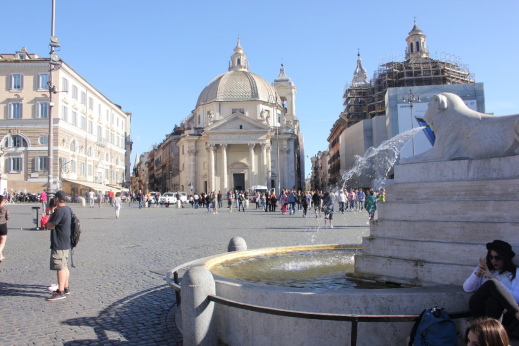Church and fountain in Piazza Popolo in Rome, Italy