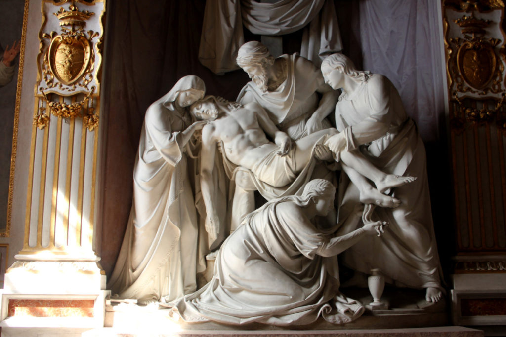 Statue of Jesus held by his apostles after he died on the cross in the Trinità dei Monti Church in Rome, Italy 