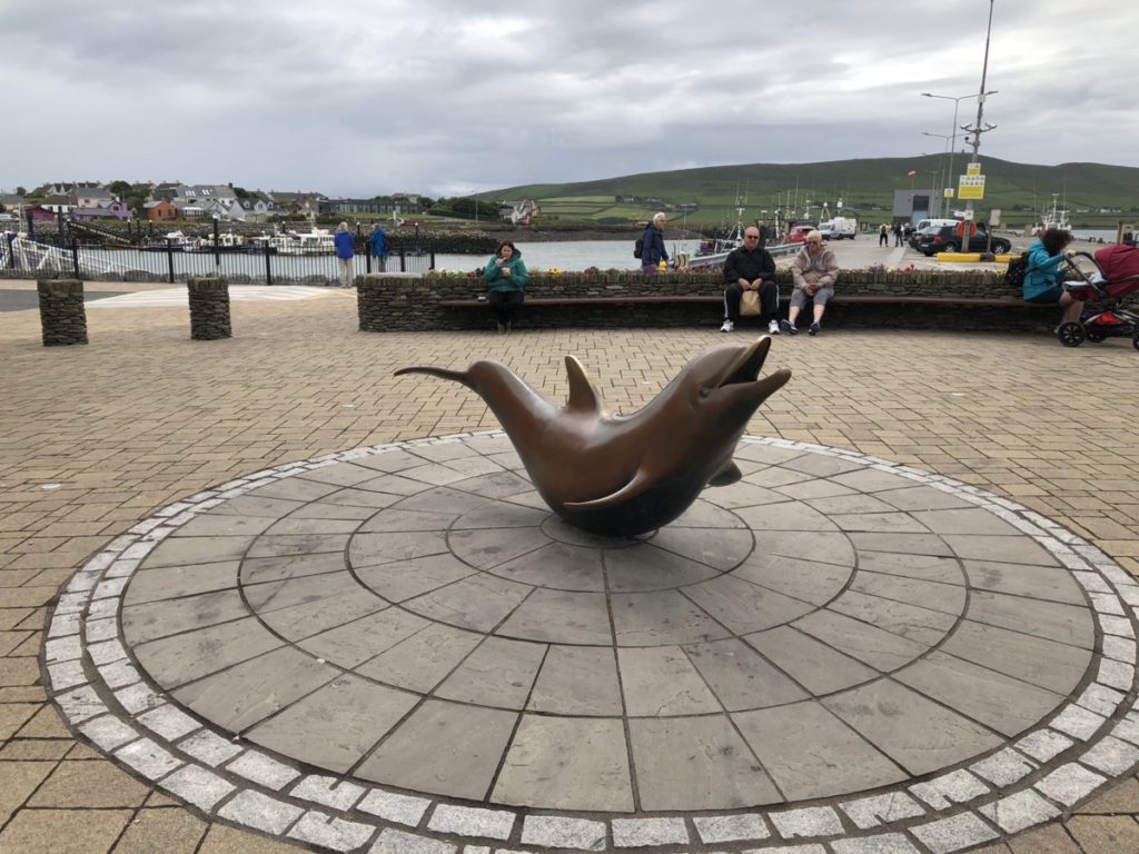 Statue of Fungie, the Dolphin in front of Dingle Bay