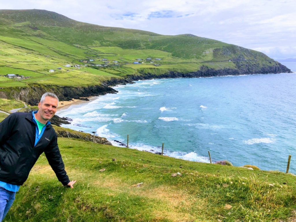 A Man in front of Coumeenoole Beach on the Dingle Penisula in Ireland