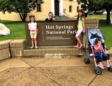 4 kids in front of Hot Springs National Park sign