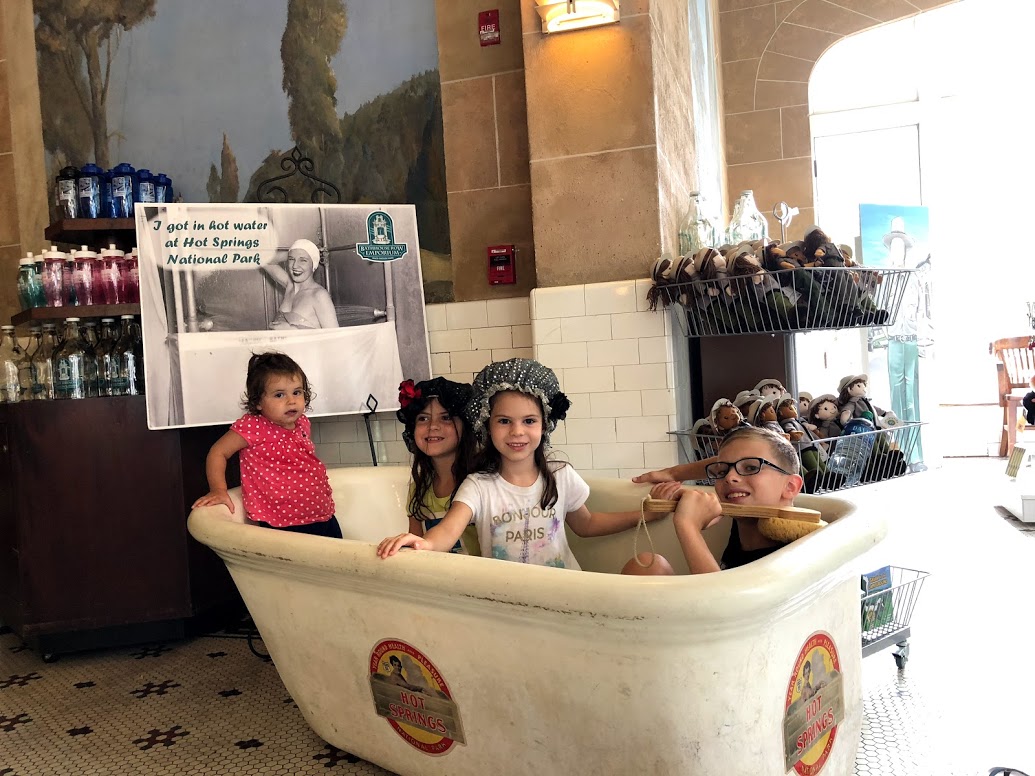 Clothed kids in a tub at Hot Springs National Park
