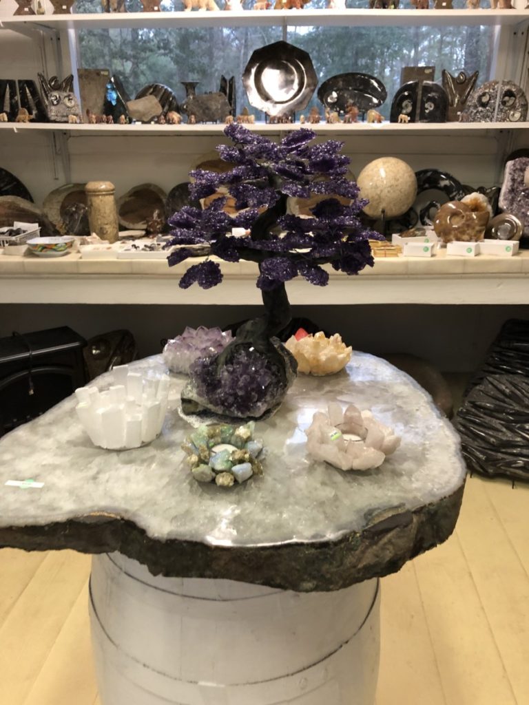 Purple Rock Tree and rocks for sale at Johnson's Rock Shop in Livingston, Texas
