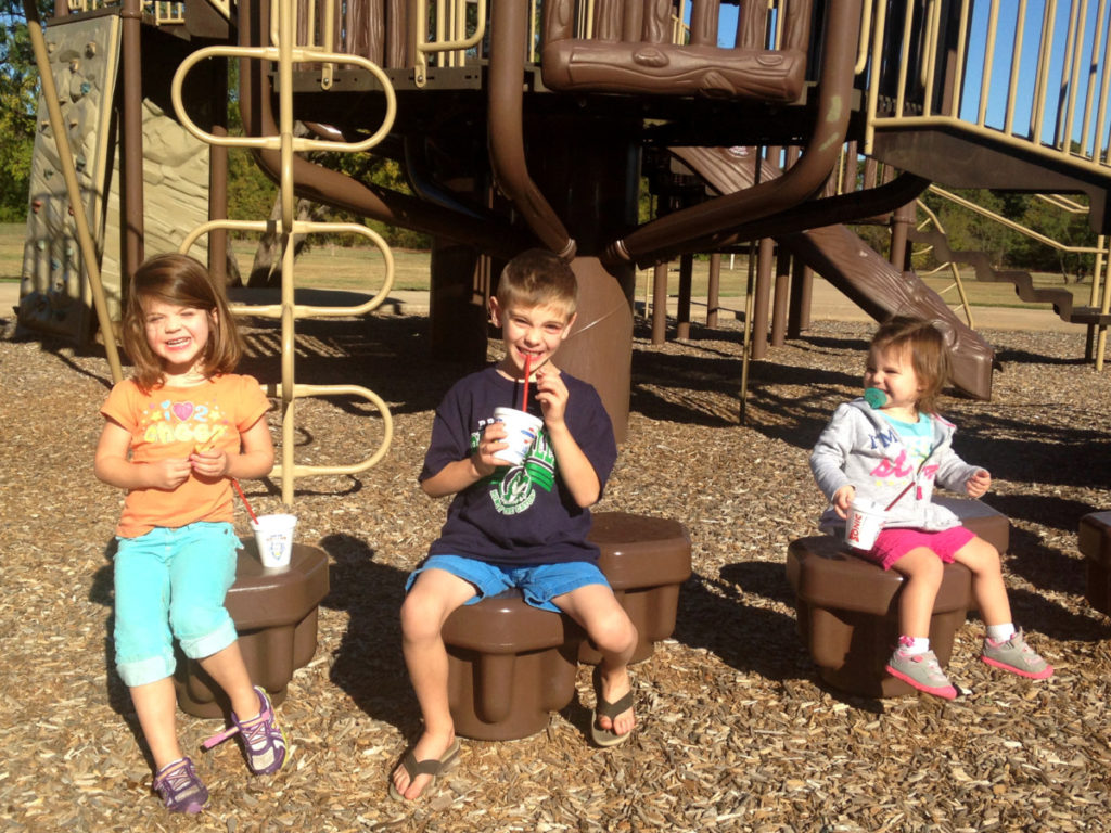 3 kids with Sonic Happy Hour Drinks and at a DFW park 