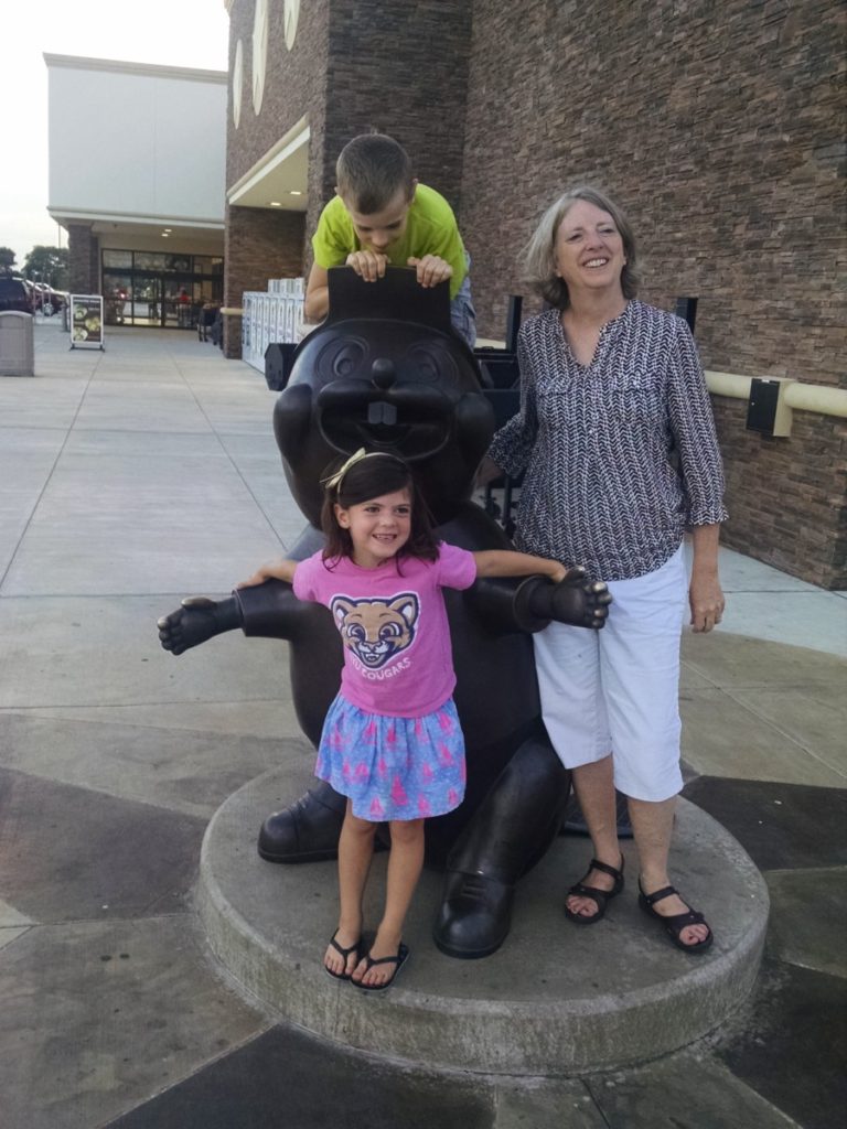 Bu-cees in Roanoke with 3 kids climbing on the beaver