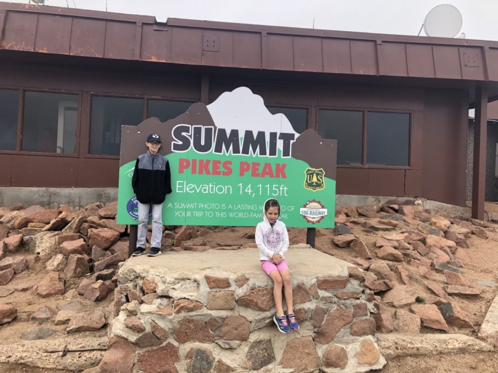 2 kids at the summit of Pikes Peak
