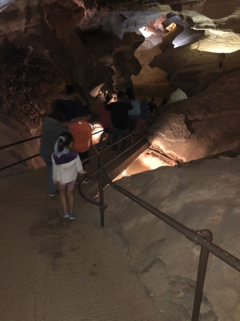 A tour group winds through the Cave of the Winds Discovery tour Path