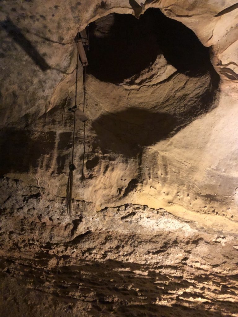 An old ropp ladder hangs from the original Entrance to Cave of the Winds tours