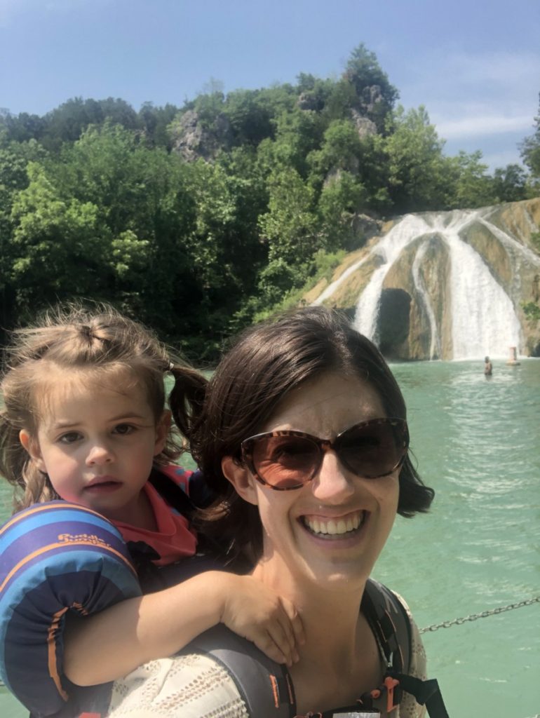 Mom with toddler on her back at Turner Falls
