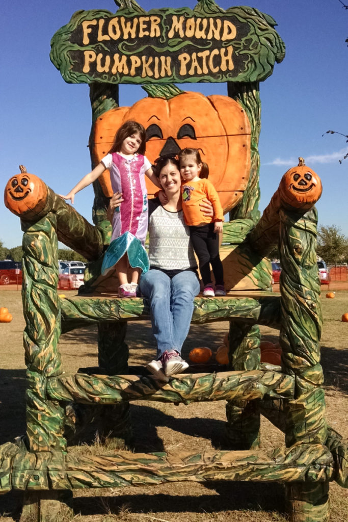 Mom and 2 daughters on the Giant Chair at the Flower Mound Pumpkin Patch