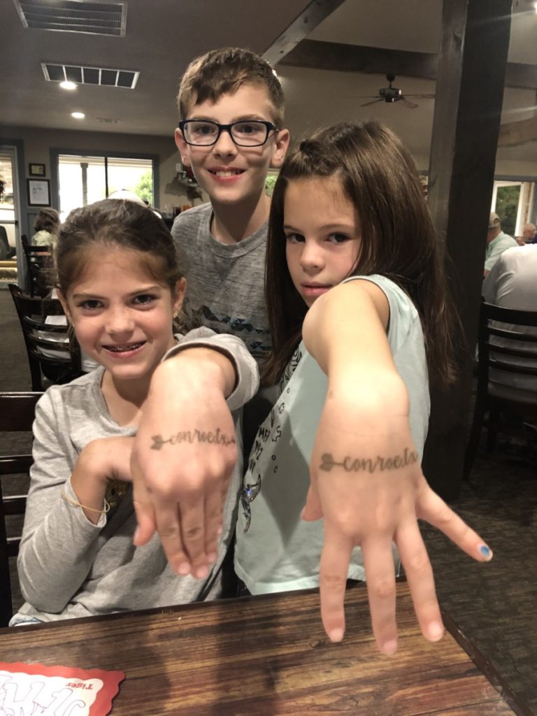 3 kids show tattoos of Conroe Texas