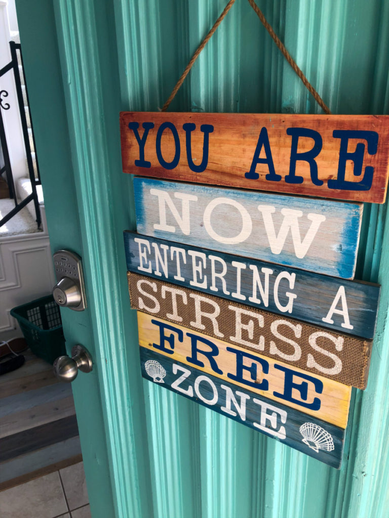 You are now entering a stress free zone sign at Simply the Best Texoma Luxury Rentals sign on the door