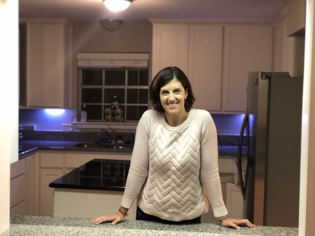 woman standing in open window to Kitchen at Texoma Luxury Properties, where to stay near DFW