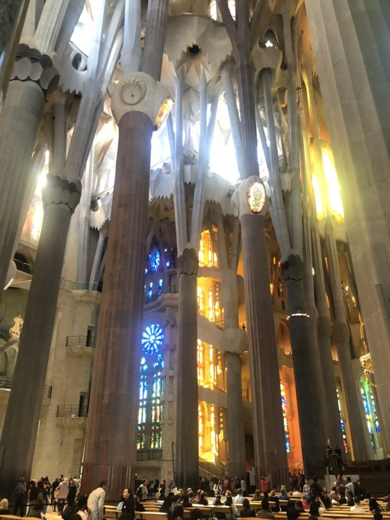 Inside the Sagrada Familia in Barcelona, tall lpillars