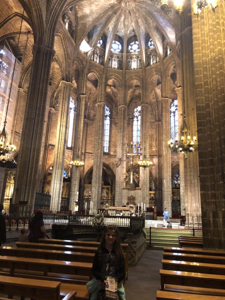 Young Girl Enjoys the Gothic Architecture inside the Barcelona Cathedral
