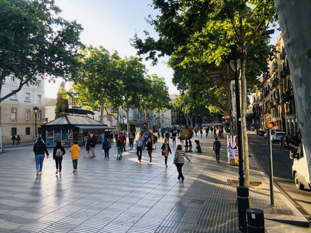 People walking along La Rambla Street in downtown Barcelona