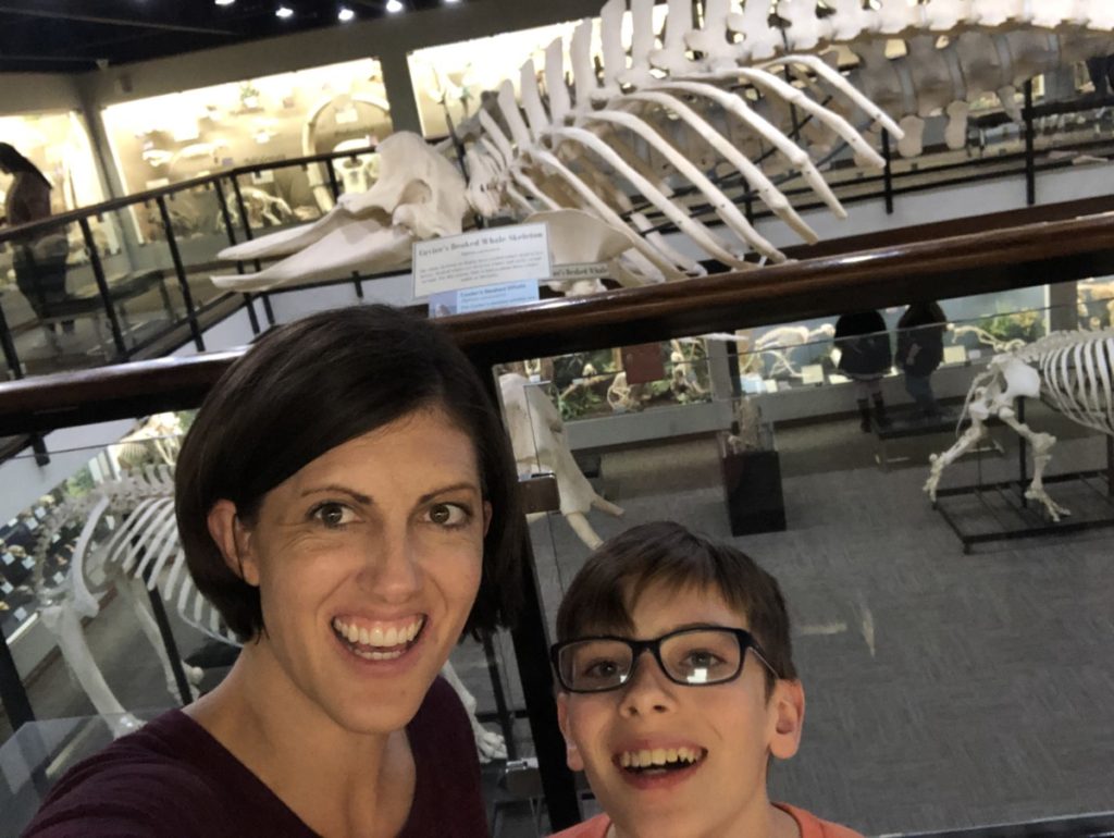 Mom and son in front of Whale Skeleton at the Osteology Museum in OKC