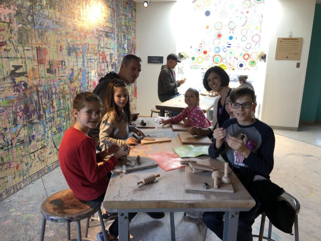 Family of 6 Creating Clay sculptures at Minnesota Childrens Museum