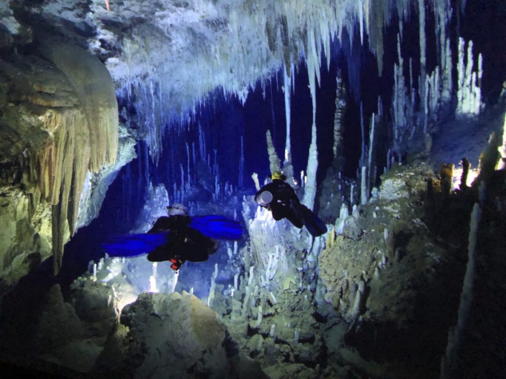 Omnitheatre screen with scuba divers in a cave at Minnesota Science Museum
