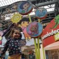 Toddler showing rides El Circulo de Cielo and Guppy Bubbler at Nickelodeon Universe in Mall of America in Minneapolis