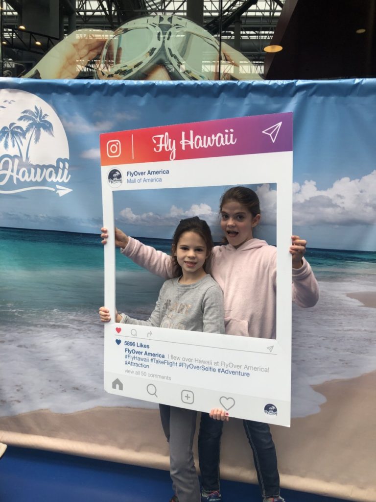 2 girls in an Instagram photo frame at FlyOver Hawaii Ride in Mall of America Minneapolis