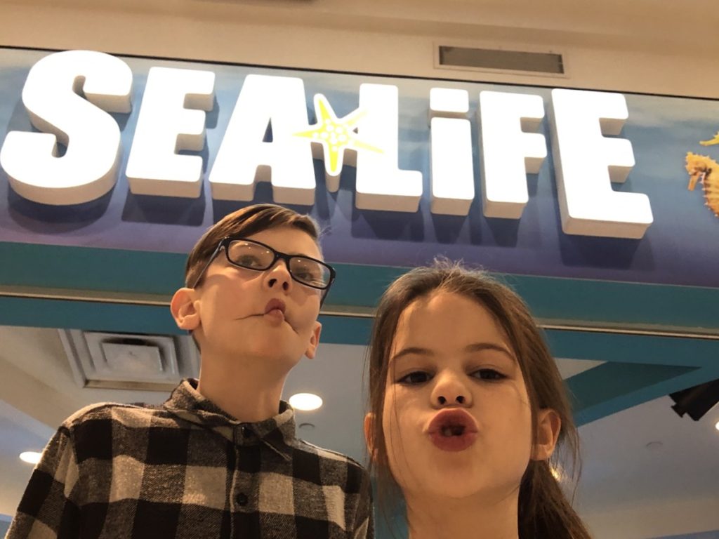 2 kids in front of Sea Life Aquarium at the Mall of America in Minneapolis