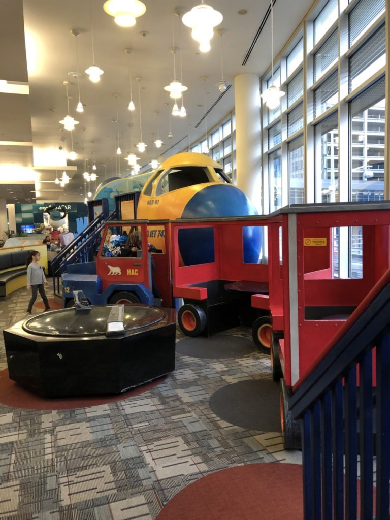 girl plays at the Minneapolis St. Paul Airport playplace