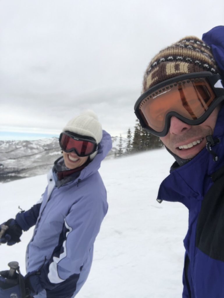 Husband and Wife skiing together at brighton ski resort while kids are in ski school