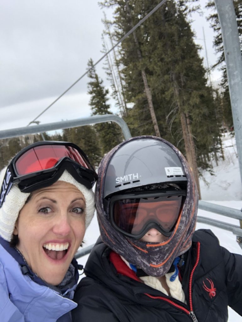 Mom and son Ride the ski lift at Brighton Ski Resort