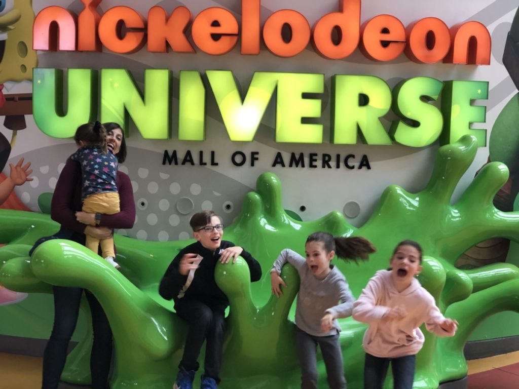 3 kids scared away of the noise maker at the entrance of Nickelodeon Universe in the Mall of America Minneapolis