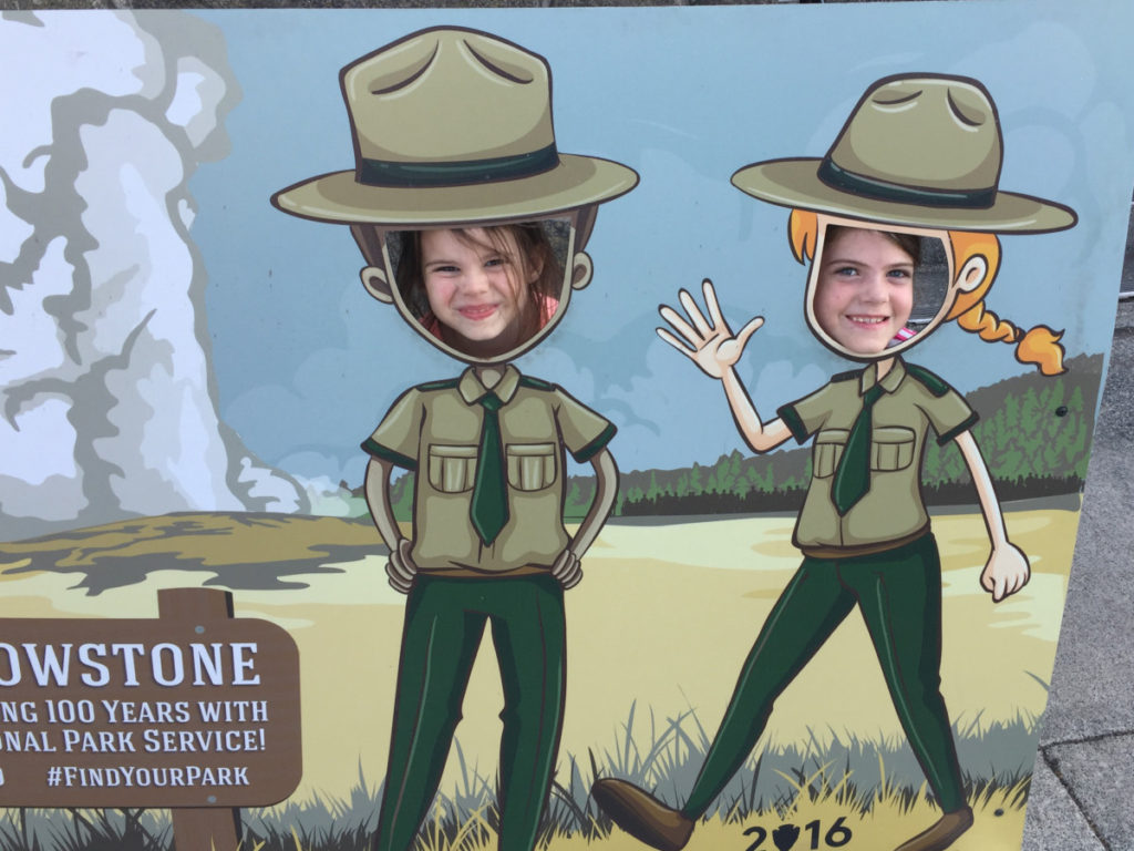 2 kids as national Park Rangers in Yellowstone Visitors Center