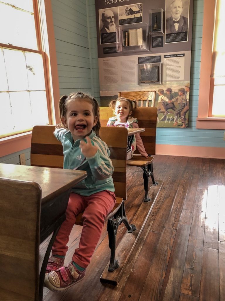 2 toddlers at the school house in Grapevine Settlement to City Museum