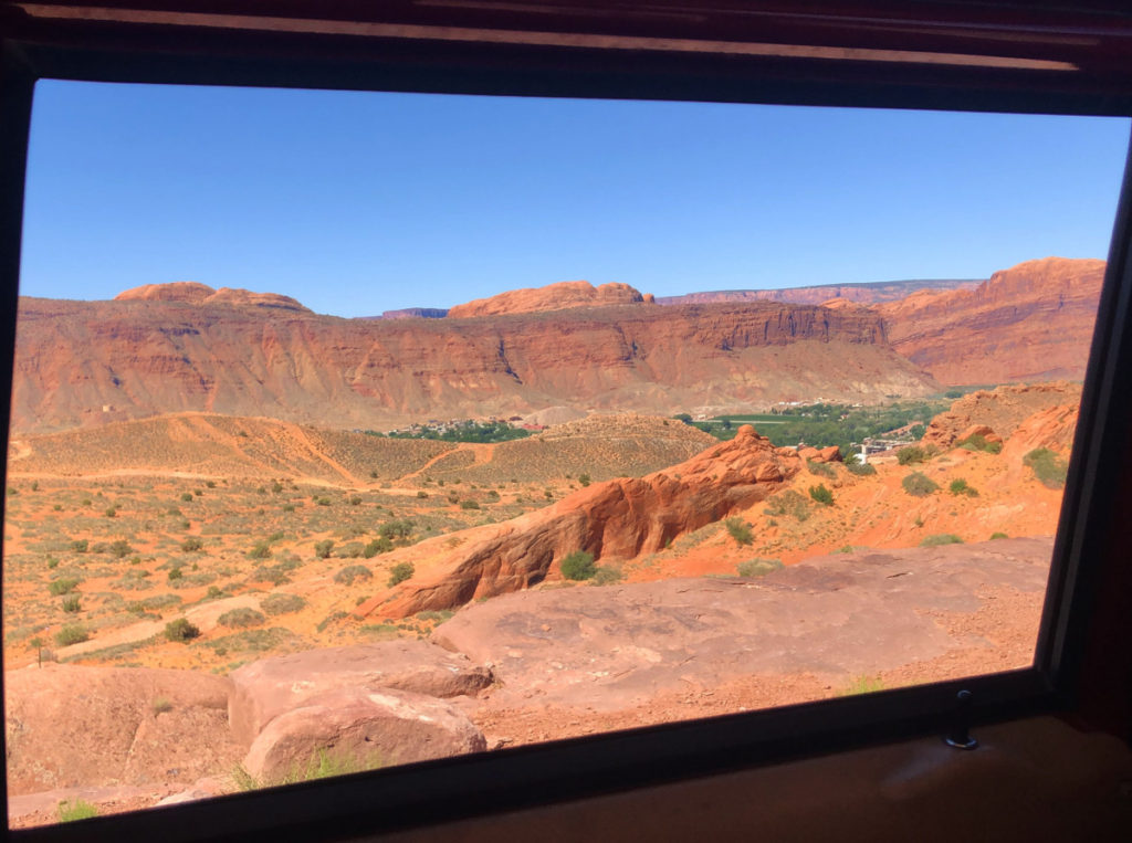 Red rock boulders and canyons from the window of a Hummer Safari Tour from Moab Adventure Center