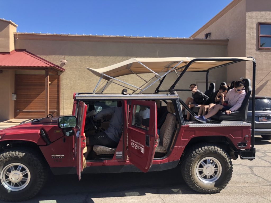 4 kids load into Hummer at Moab Adventure Center with a Private Tour Guide