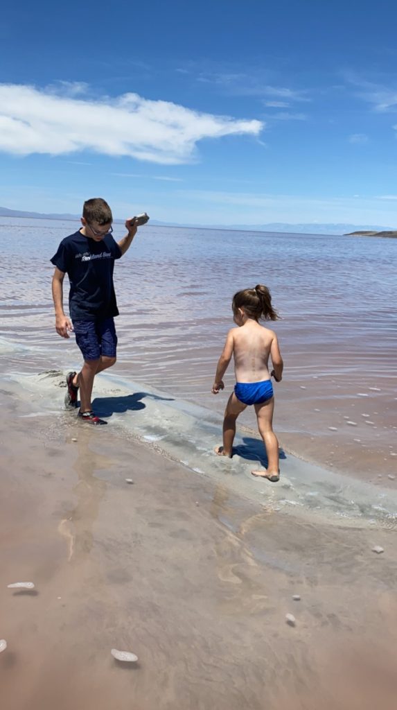 A Brother and sister play in the sand bar in the great Salt Lake