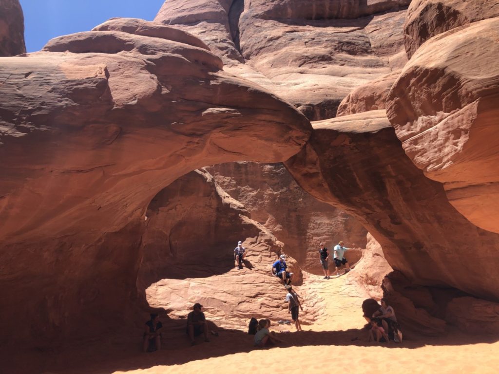 Kids play in the Sand at Sand Dune Arch in Arches National Park