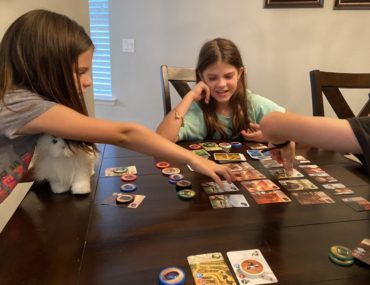 3 kids playing family games splendor