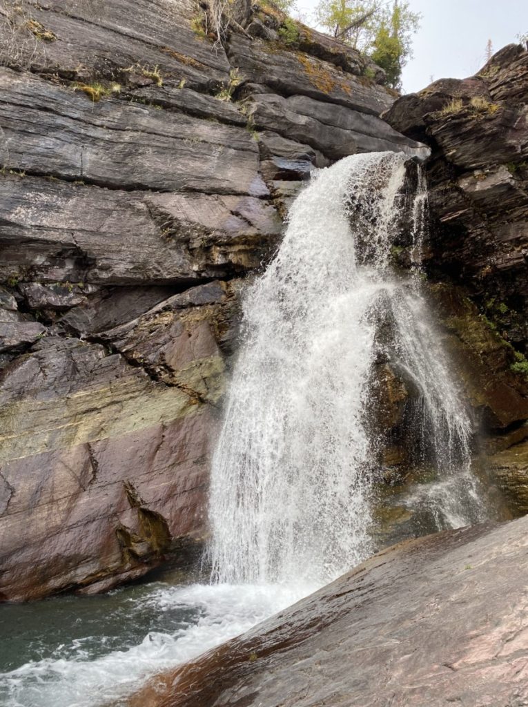 Rushing Barring Waterfall over striped rocks