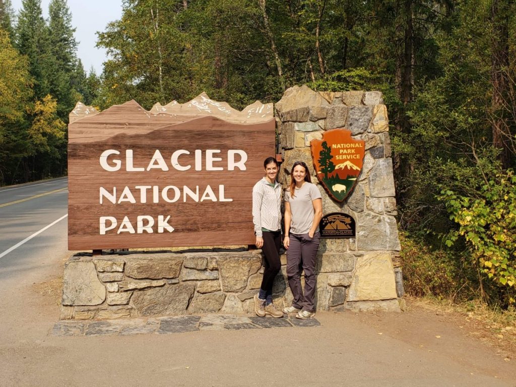 2 women at the Glacier National Park Sign