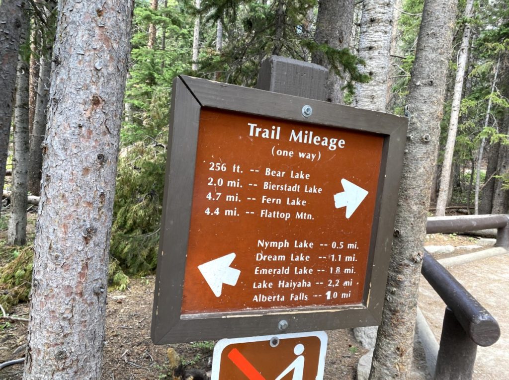 Trail Mileage sign for bear lake and Emerald Lake in Rocky Mountain National Park 